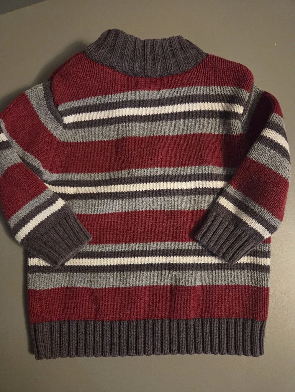 The Childrens Place Boys Striped Quarter-Zip Sweater in Burgundy and Gray.